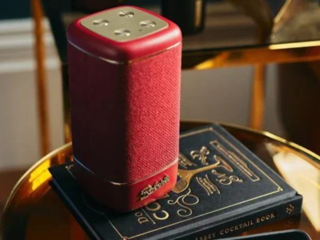 Red Roberts Beacon speaker on a side table.