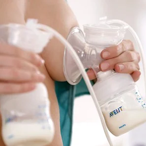 Detail of the Philips Avent breast pump in use.